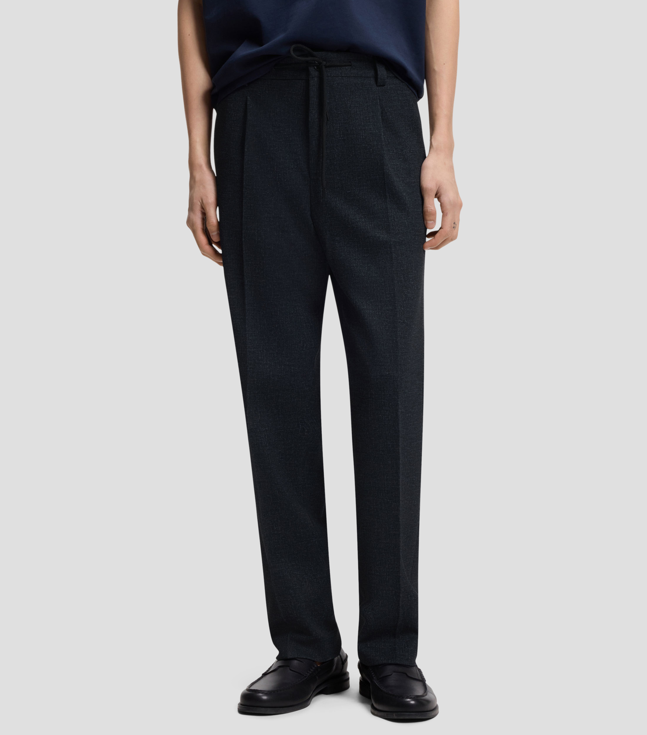 Pantalones regular fit en tejido elástico con microestampado Hombre
